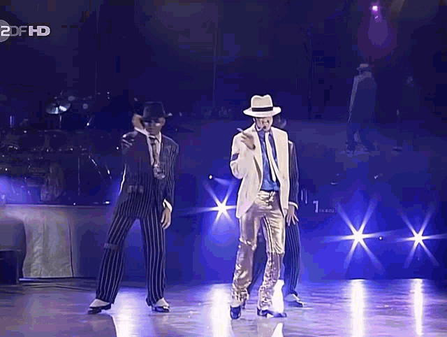 a man in a white hat is dancing on a stage in front of a 2dfhd logo