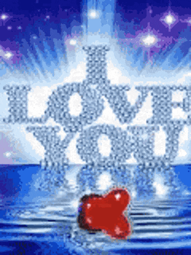 a red heart is floating in the water with the words " i love you "