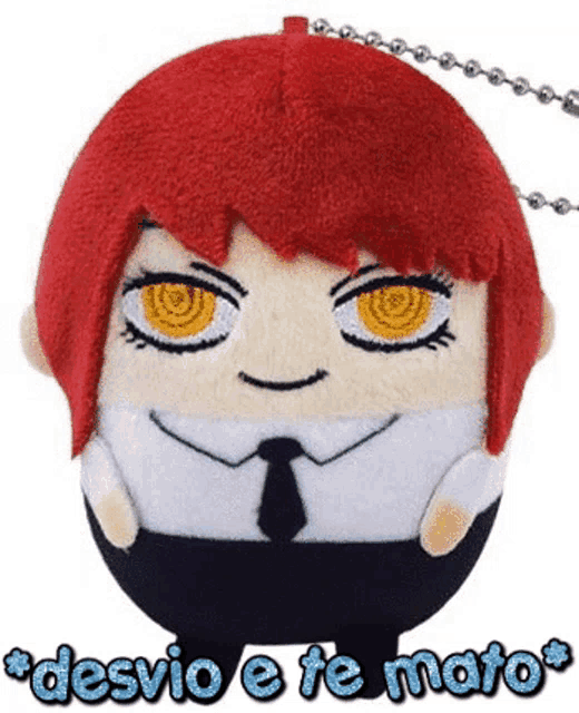a stuffed doll with red hair and yellow eyes is sitting on a chain .