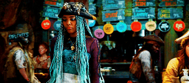 a woman with blue braids and a pirate hat is standing in front of a sign that says explorers