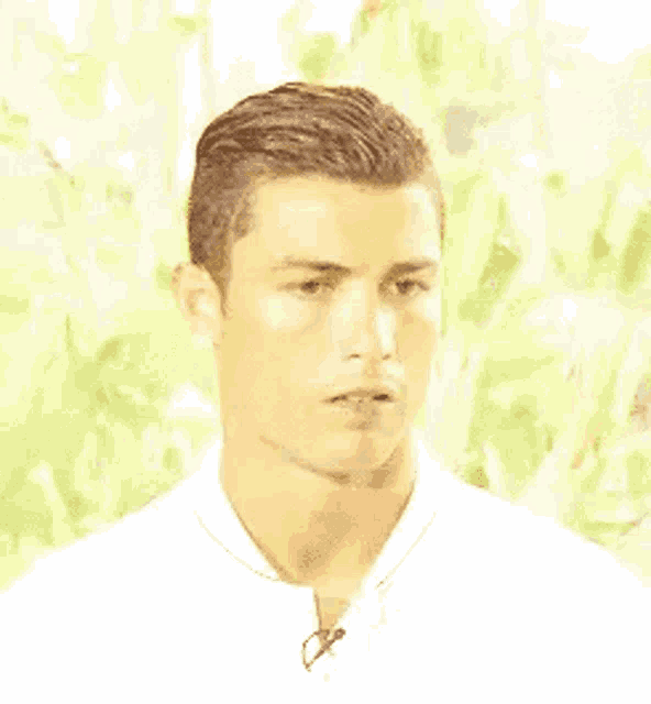 a close up of a man wearing a white shirt with a microphone on his neck .