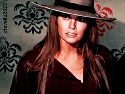 a woman with long hair wearing a hat with the year 2023 on the bottom right