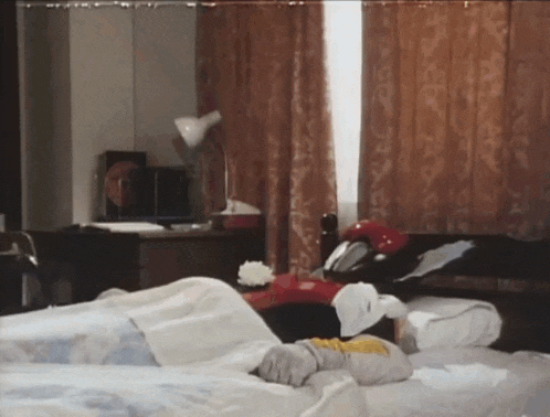 a person laying on a bed in a room