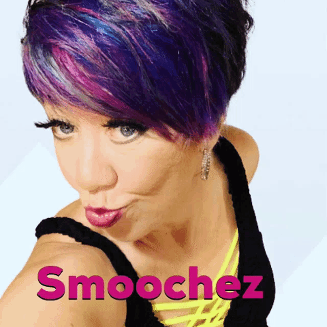 a woman with purple hair has smoochez written in pink