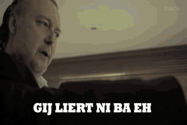 a man with a beard says gij liert ni ba eh in white letters