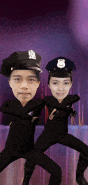 a man and a woman dressed as police officers are posing for a picture