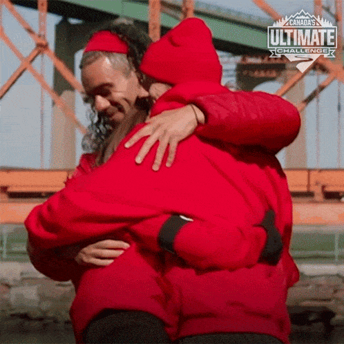 two people hugging each other with the words canada 's ultimate challenge written on the bottom