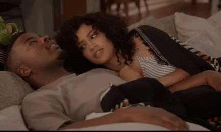 a man and a woman laying on a couch