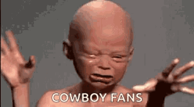 a bald baby is crying and says `` cowboy fans '' .