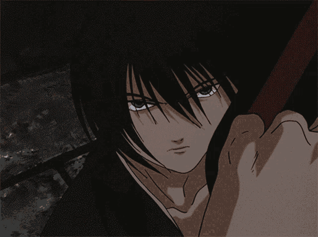 a close up of a person 's face with a sword in his hand
