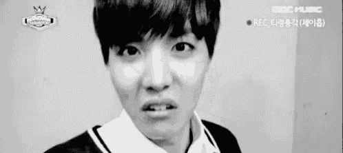 a close up of a person making a funny face .