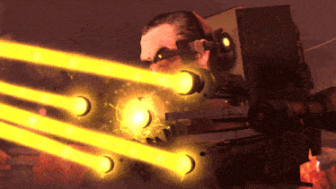 a man is holding a machine that is shooting yellow lights
