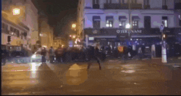 a crowd of people are gathered in front of a building that says o'reillyvan