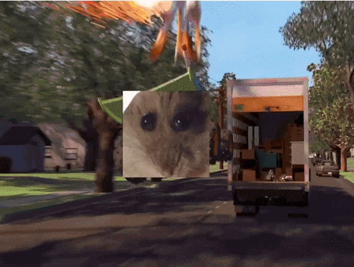 a moving truck with a picture of a cat on the back of it