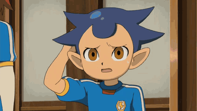 a boy with a blue shirt with a lightning bolt on it