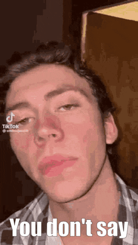 a close up of a man 's face with the words `` you don 't say '' written on it .