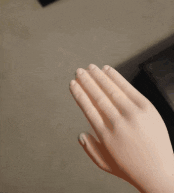a close up of a person 's hand with a ring on it