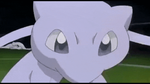 a white pokemon is standing on a green field .
