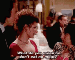 a woman in a red dress says what do you mean he don 't eat no meat .
