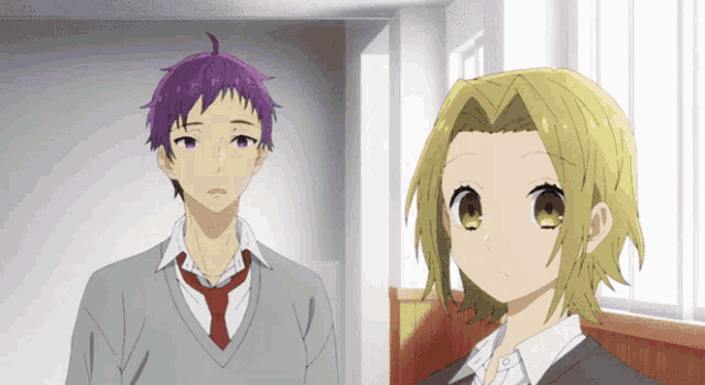 a boy with purple hair and a girl with blonde hair standing next to each other