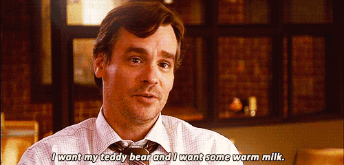 a man in a white shirt and tie is saying i want my teddy bear and i want some warm milk