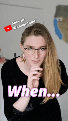 a woman wearing glasses and a black dress with the words alice in wonderland above her head