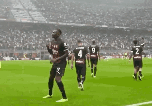 a soccer player with the number 4 on his shirt