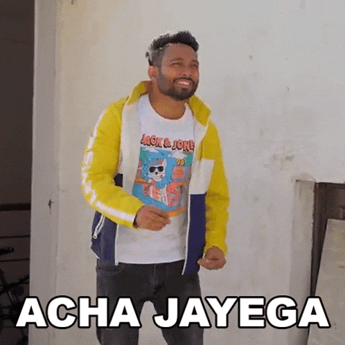 a man wearing a yellow jacket and a white t-shirt with the words acha jayega written on it