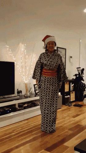 a woman wearing a santa hat and a kimono