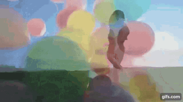 a woman is standing in front of a bunch of balloons in a painting .