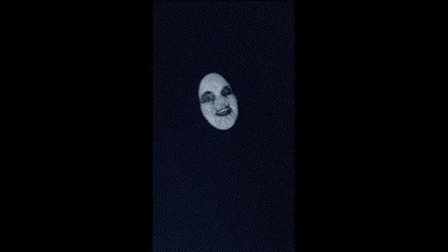 a close up of a person 's face with a mask on