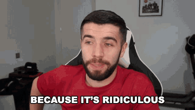 a man sitting in a chair with the words because it 's ridiculous below him