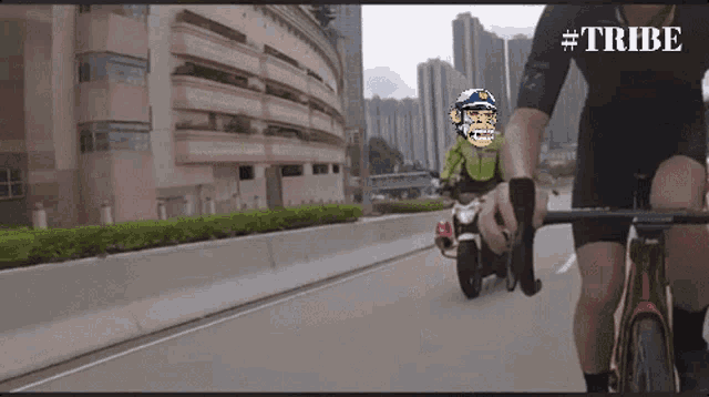 a man riding a bike with a motorcycle behind him and the words #tribe on the bottom