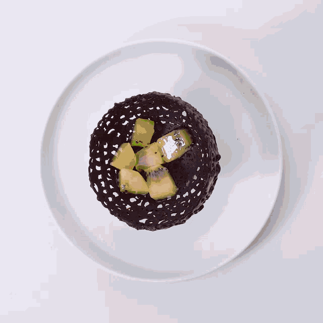 a blurred image of a bowl of food on a plate on a table