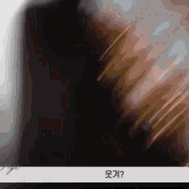 a close up of a person 's face with chinese writing on the bottom of the screen
