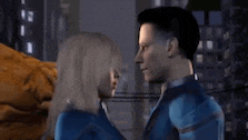 a man and a woman are standing next to each other and kissing .