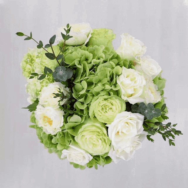 a bouquet of colorful flowers including roses and chrysanthemums
