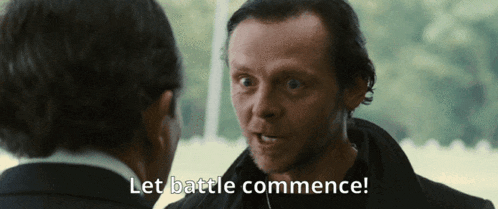 a man talking to another man with the words let battle commence