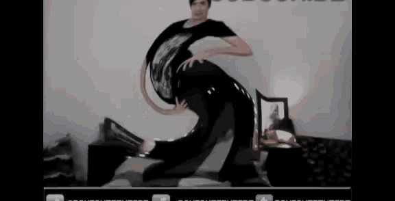 a man in a black shirt is being morphed into a snake