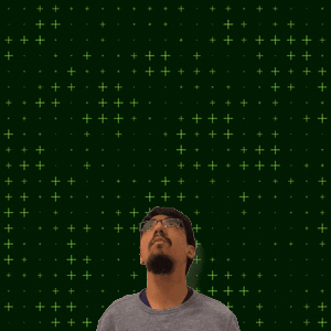 a man with glasses looks up at a green cross