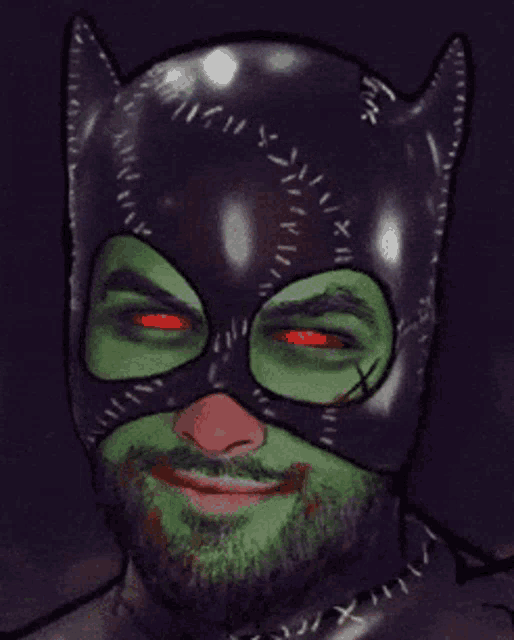 a man with a beard is wearing a cat mask and smiling