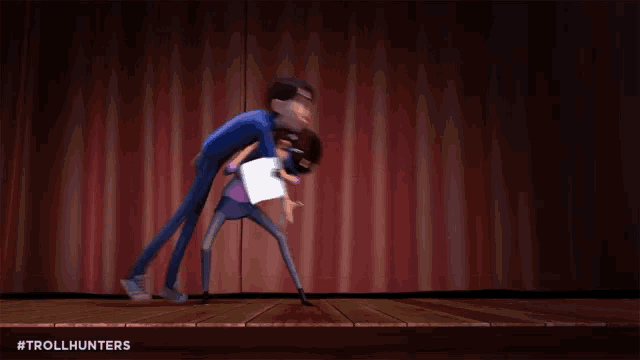 a cartoon of a woman kicking a man on a stage with the hashtag trollhunters at the bottom