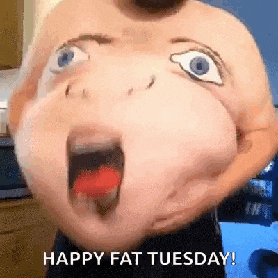 a man with a cartoon face painted on his belly is holding a red candy in his mouth .