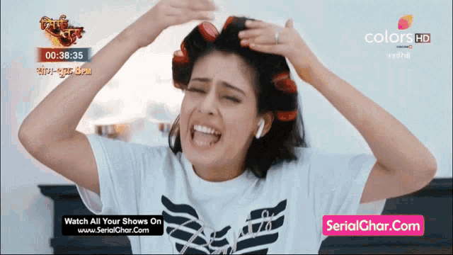 a woman with curlers on her head is on a screen that says serial char.com