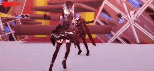 a couple of anime characters are dancing together on a stage .