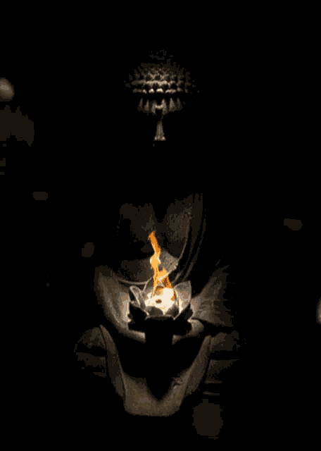 a statue of a buddha holding a lotus flower