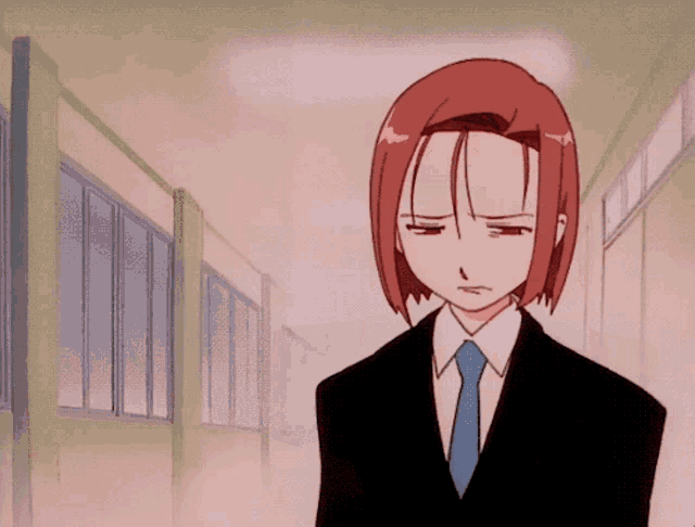 a cartoon character with red hair and a blue tie