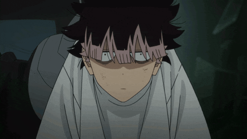 a close up of a person 's face with a white shirt and black hair