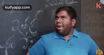a man in a blue shirt is standing in front of a chalkboard with the words kulfyapp.com written on it