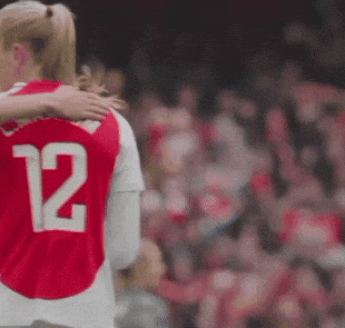 a soccer player with the number 12 on her back
